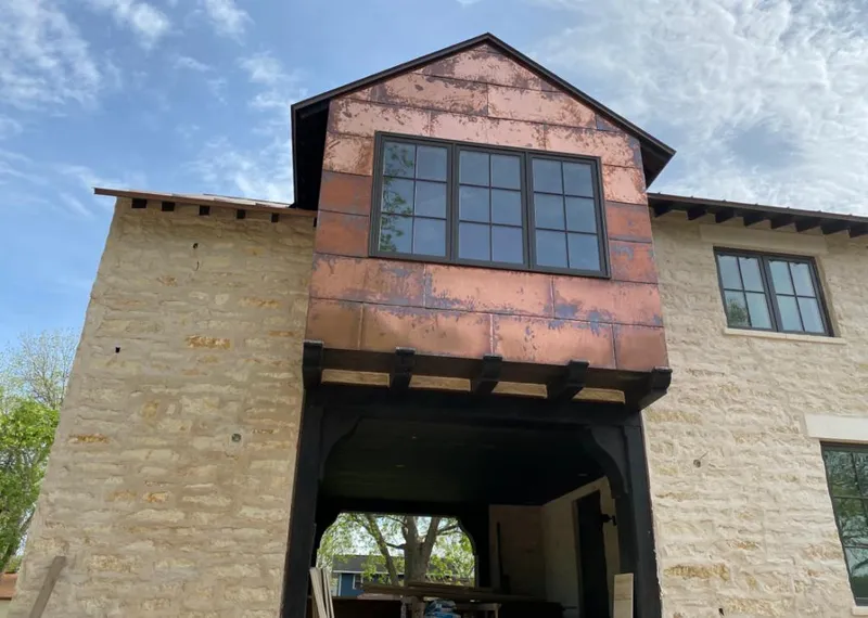 Copper metal panel facade on a stone building for Metal Roof Coating in Linthicum